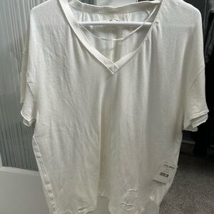 Free people distressed white T shirt brand new with tags XS but oversized!